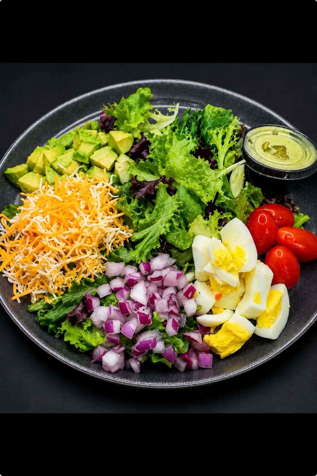 Avocado Cobb Salad — mixed greens, avocado, mixed veggies, hard-boiled egg and shredded jack cheese w/ green goddess dressing