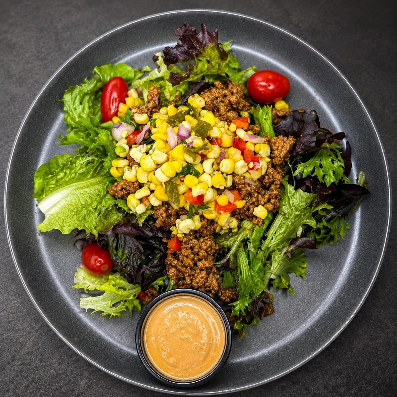 Turkey Taco Salad — with mixed greens, poblano & roasted corn salsa tossed in chili vinaigrette